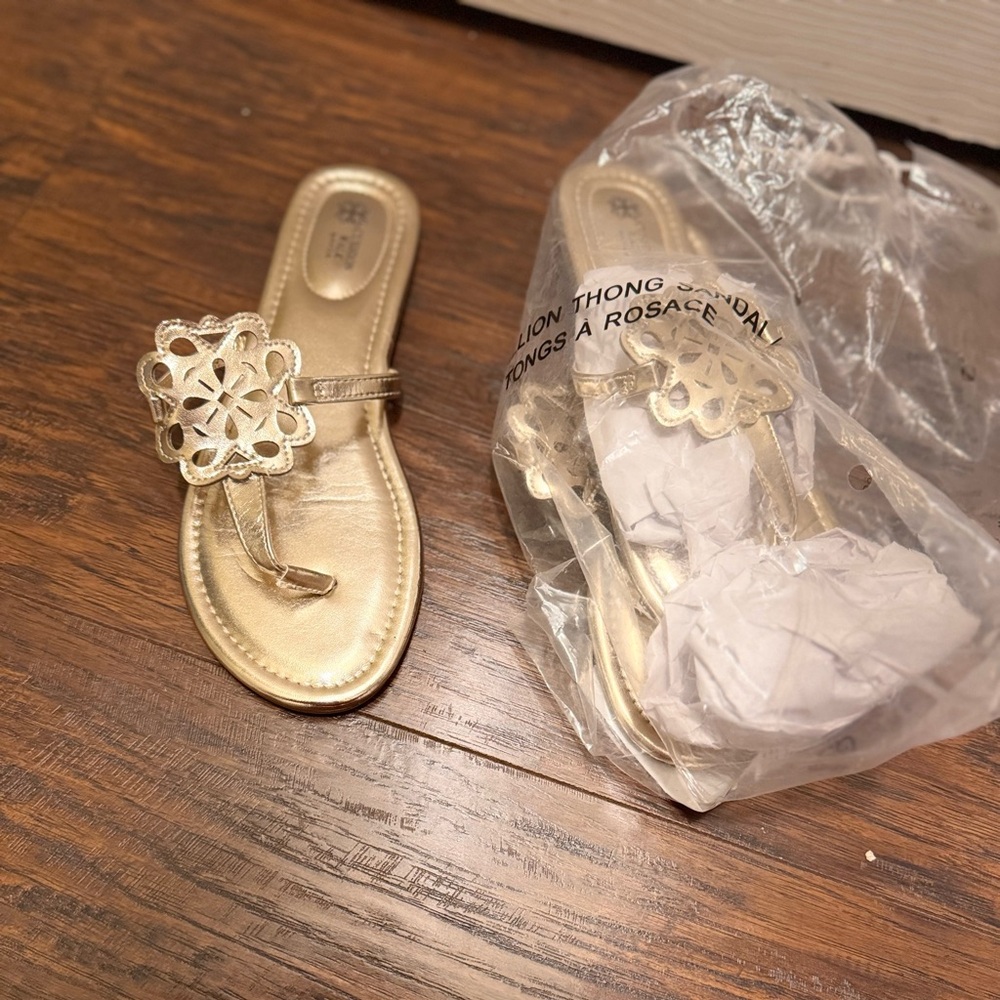 Gold womens sandals. Brand new. Never worn